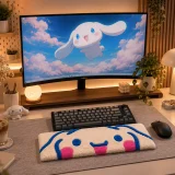 Hand tufted multicolor wrist rest with cute character design placed on a cozy desk setup beside a keyboard, mouse, notebook, and small decorative items.